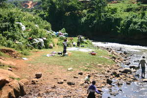 Women & children wash clothes in the Chania River