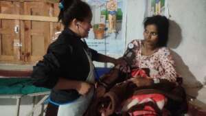 Dedicated staff checking Samjhana's health.