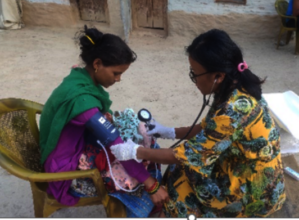 PHASE Nepal staff monitors Samjhana post-delivery