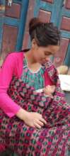 A mother and  baby met for postnatal care at home.