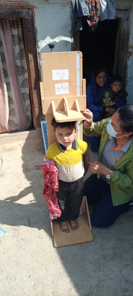 Community child growth monitoring at Mugu.