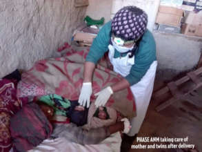 A PHASE Nurse attends mother after a twin delivery