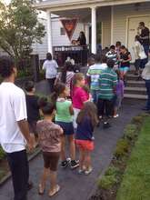 Kids line up for Haloween face-painting.