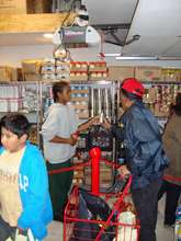 Getting FREE groceries from our shelves.