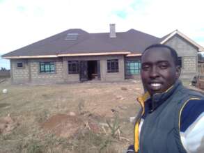 Enoch and one of his new houses