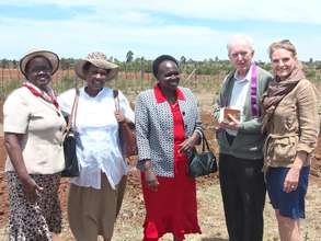 Prof. Margaret Kamar, land donor (in red)