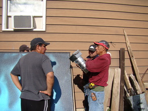 Leo working with trainees and ductwork