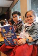 Young readers with their new books.