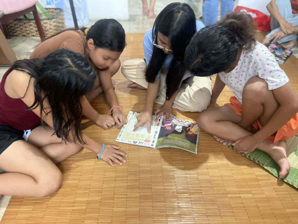 Young girls with our safe internet activity book