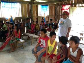 Dingalan children waiting to receive their books