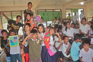 A classroom celebrates the GlobalGiving books!