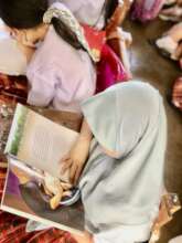 Student in Sultan Esmael ES deep into the pages