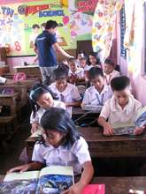 Checking out the books at Krus na Ligas Elementary
