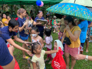 Alitaptap Artists distribute books despite rain