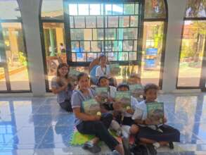 Children in Coastal Tingloy receive our books