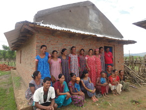 Group members and new community learning centre