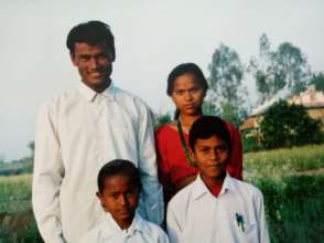 Tharu parents with their children