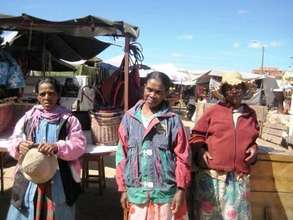 The women in front of their current sales stall