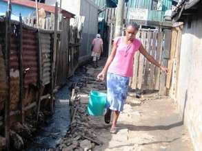 Collecting water in the slum of Andavamamba