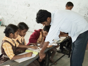 Class teacher guiding our children for studies
