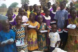 Orphans very happy with their donations for school