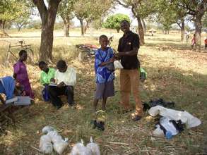 Orphan receives food donation from CCI - Uganda