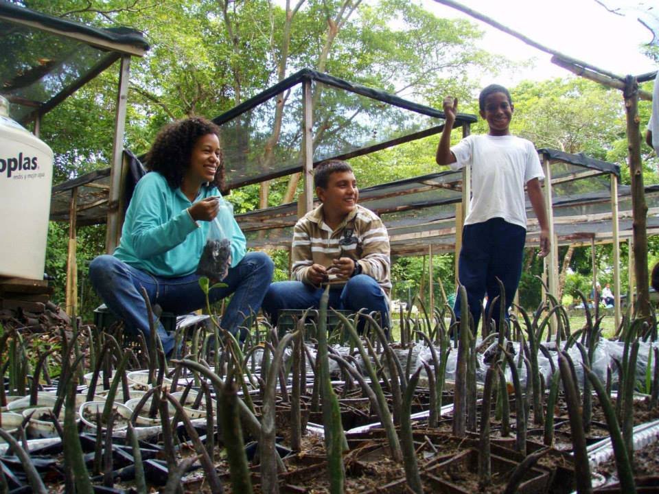 Happy volunteers (and seeds) at the nursery