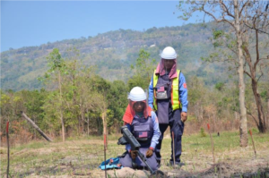 Deminers working on a minefield in NW Cambodia