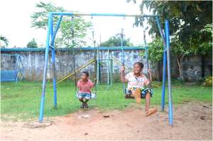 Children at an orphanage bordered by a minefield
