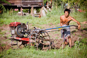 Farmer ploughs cleared ground for the first time.