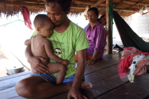 Tauv and his child in Cambodia