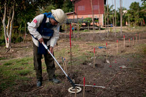 Deminers methodically seek and destroy landmines