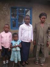 Maman Musa poses with three of her children