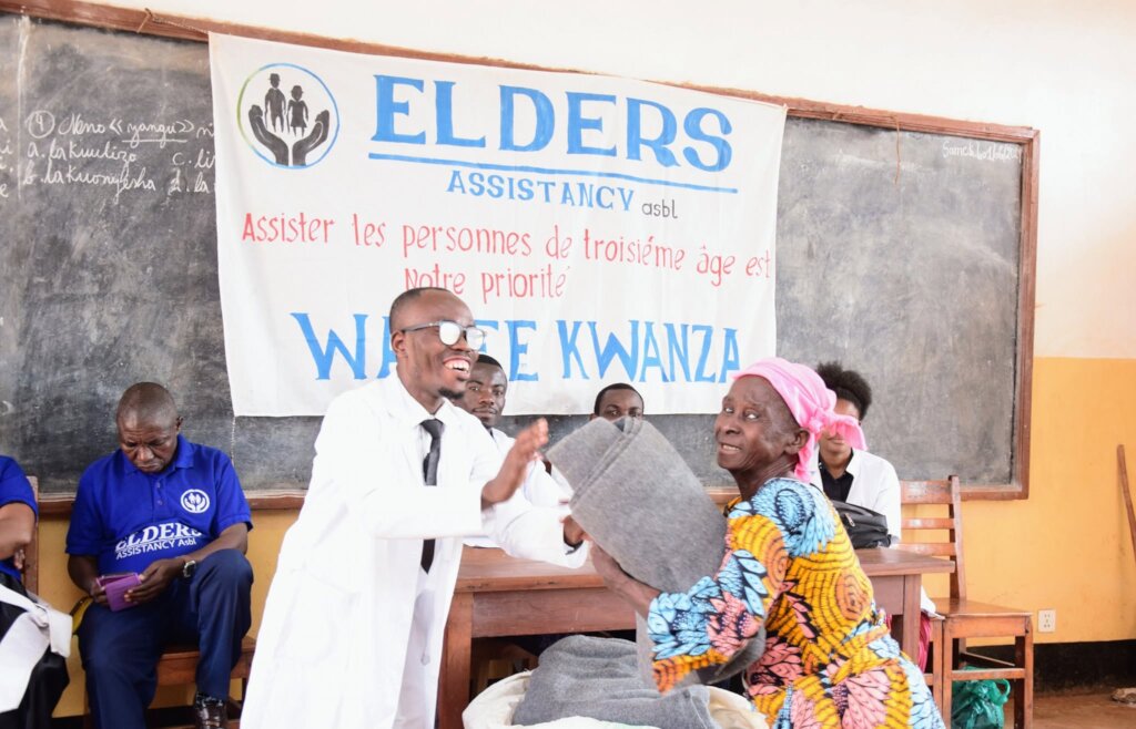 Warm Elderly People in Bukavu With Blankets