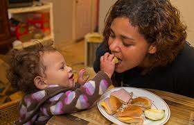Mom and Child Eat Together