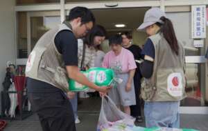 AAR Namatame (left) handing out relief supplies