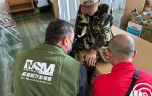 An MSM staff member (left) listening to a survivor