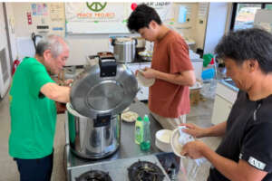 Staff member preparing meals