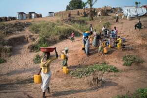 Families fetching water from unsafe river