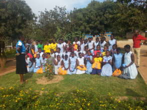 Senior woman,learners and the volunteers photo