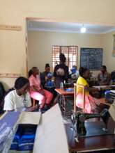 Esther-field worker distribute sanitary pads