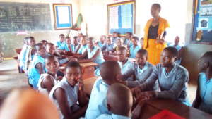 Senior woman briefing pupils on the day's activity