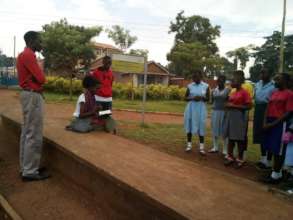 Global visitor interacting with beneficiaries
