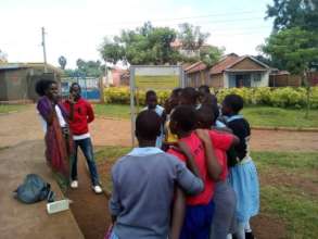 Global visitor taking photos of beneficiaries