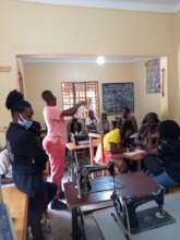 A lady demonstrating  how to use sanitary pads