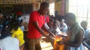 Our volunteer from Malawi is distributing pads