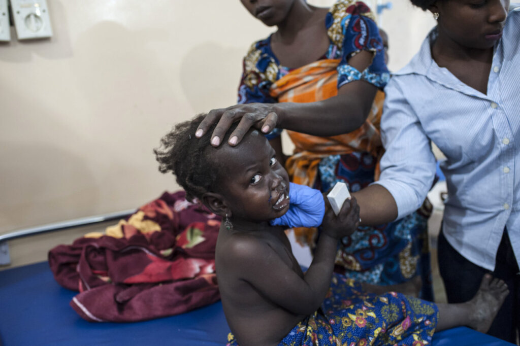 A little girl recieve care in the IDP Camp