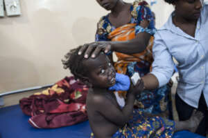 A little girl recieve care in the IDP Camp