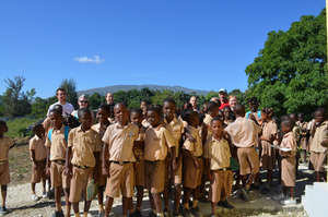A large group of students with some of our team