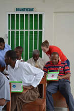A team member helping a teacher with the internet